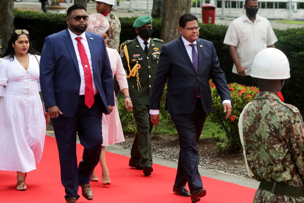 Forward march: Suriname President Chandrikapersad Santokhi (right) and his counterpart from Guyana, Irfaan Ali
