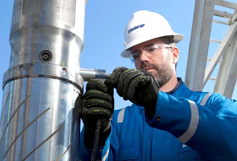 Big contract: a Schlumberger field engineer prepares the GeoSphere downhole reservoir mapping tool