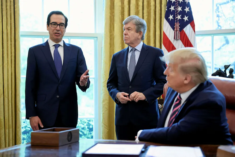 Propoals: US President Donald Trump (right) with Treasury Secretary Steven Mnuchin (left) before signing the Paycheck Protection Program & Health Care Enhancement Act