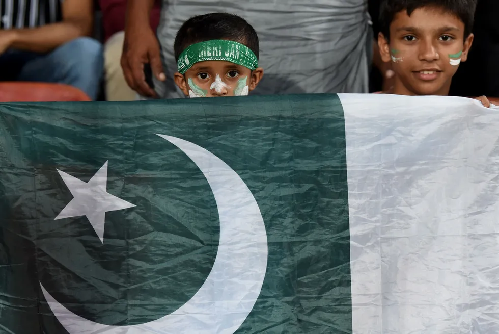 Patriotic: children hold Pakistan's national flag during a one-day international cricket match between Pakistan and Bangladesh in September 2023.