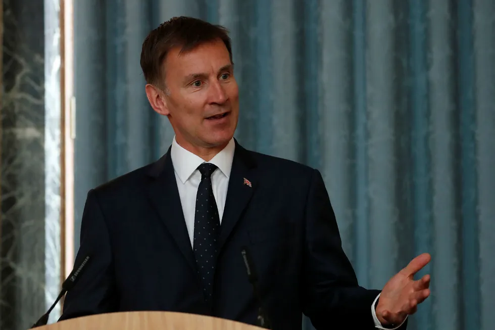 Britain's Foreign Secretary Jeremy Hunt, gestures as he answers a question during a press conference with the Bishop of Truro Philip Mounstephen about the Bishop's final report into the Foreign Office's support for Persecuted Christians around the world, in London, Monday, July 8, 2019. (AP Photo/Alastair Grant, pool)