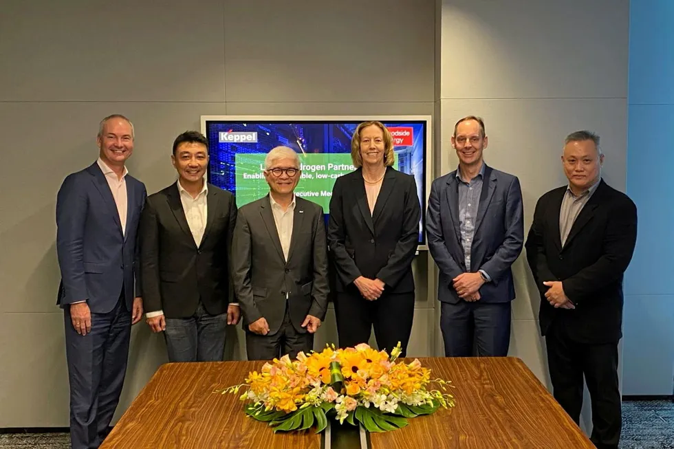 Executives from Woodside and Keppel, including Wong Wai Meng, CEO for data centres at Keppel (second from left); Thomas Pang, senior managing director in Keppel's CEO office (third from left); and Meg O'Neill, CEO of Woodside (fourth from left).