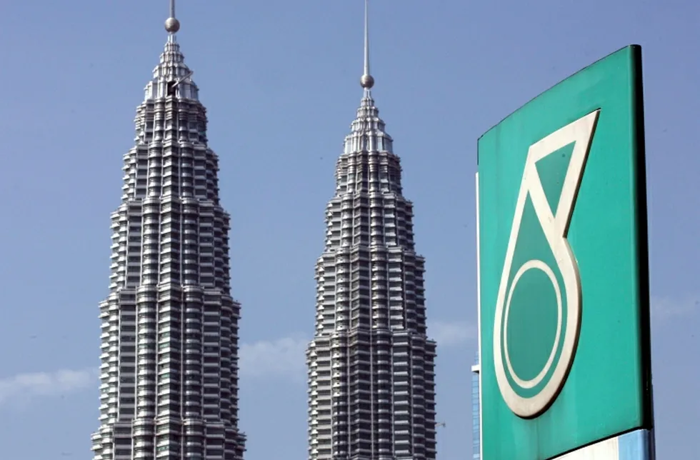 Hometown: the Petronas Twin Towers is seen behind the company logo in downtown Kuala Lumpur