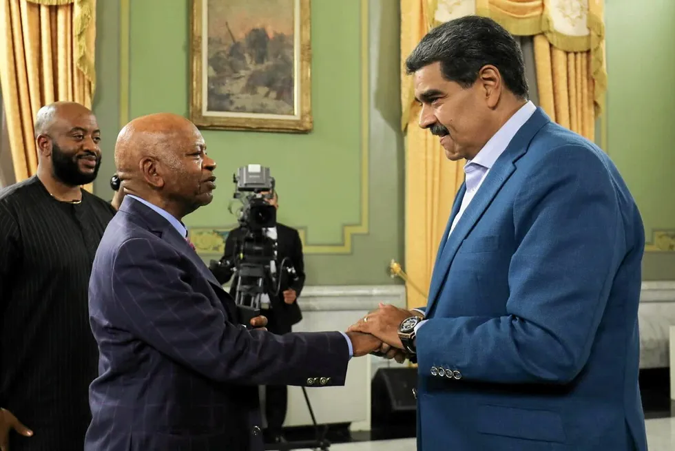 President Nicolas Maduro of Venezuela (right) greets Prince Arthur Eze in Caracas.