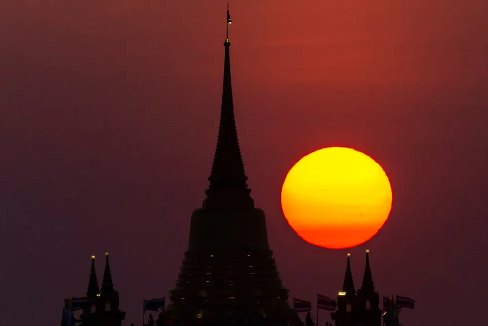 Impressive: the sun setting behind the Wat Saket Temple in Bangkok, Thailand