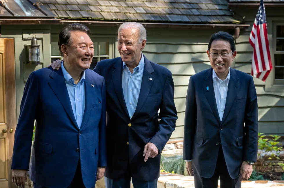 South Korean President Yoon Suk Yeol (left) and Japanese Prime Minister Fumio Kishida (right), meeting with US President Joe Biden at Camp David in August.