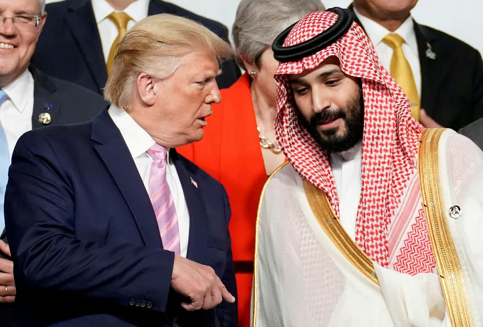 'Friends': US President Donald Trump speaks with Saudi Arabia's Crown Prince Mohammed bin Salman during photo session with other leaders and attendees at the G20 leaders summit in Osaka, Japan last year