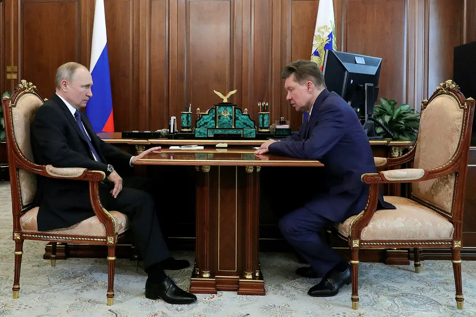 Optimism: Russian President Vladimir Putin, left, listens to Gazprom executive board chairman Alexei Miller during their meeting in Moscow, Russia, on 27 March 2020