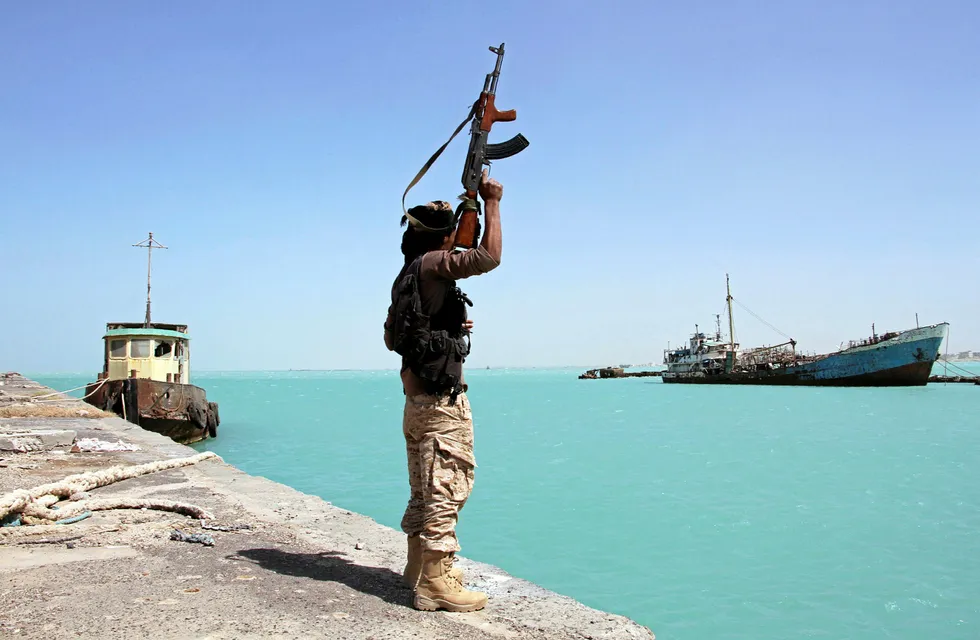 Conflict: a member of the pro-government forces at a western Yemeni port
