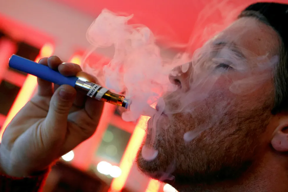 Smoke scene: a user puffs on an e-cigarette