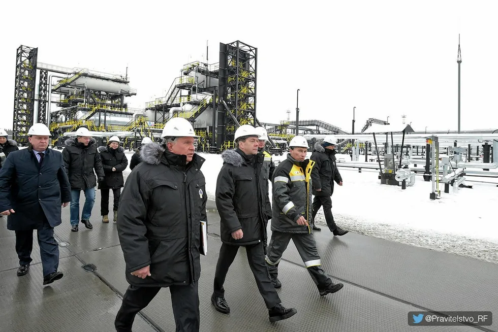 Moving forward: Rosneft chairman Igor Sechin (left) visiting the Kondinskoye field within the Erginsky licence area in West Siberia, Russia