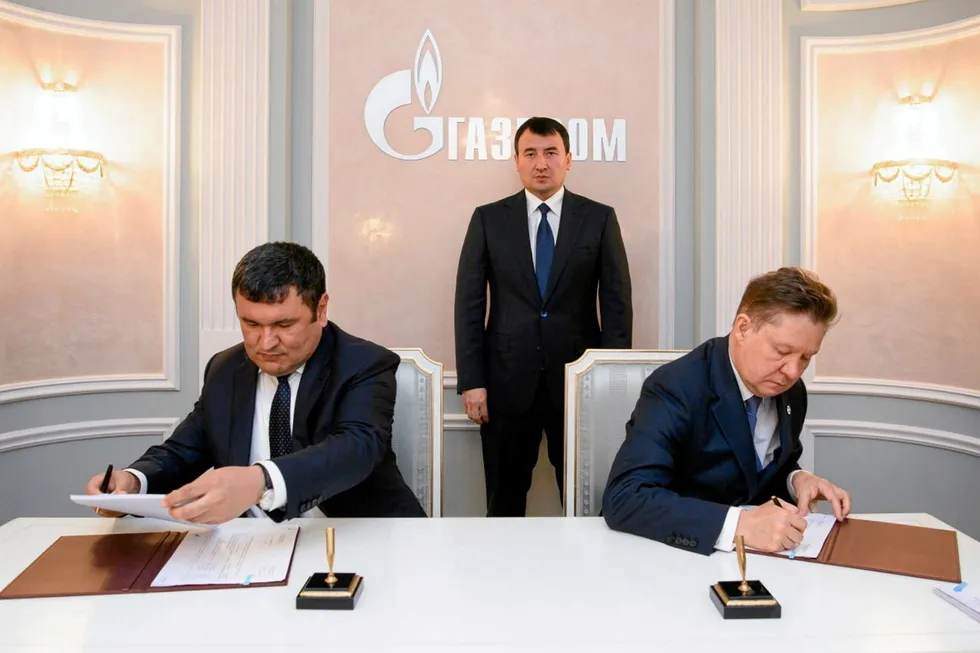 Paperwork: Uzbekistan Energy Minister Dhurabek Mirzamakhmudov (left) and Gazprom executive chairman Alexei Miller signing a gas supply agreement in St Petersburg.