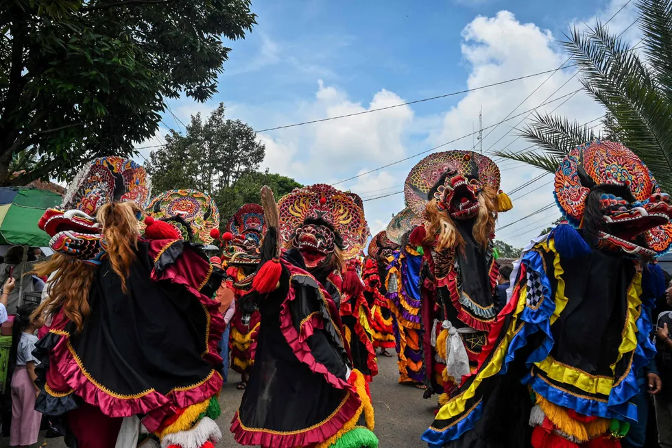 Traditional: participants dressed as deities participate in a parade during the durian festival in Wonosalam village in Jombang, in Indonesia's East Java province on 3 March 2024.