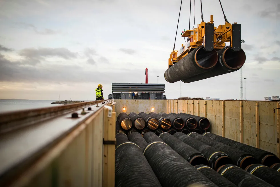 On stand-by: pipes for Nord Stream 2 are loaded onto a vessel in the German port of Mukran