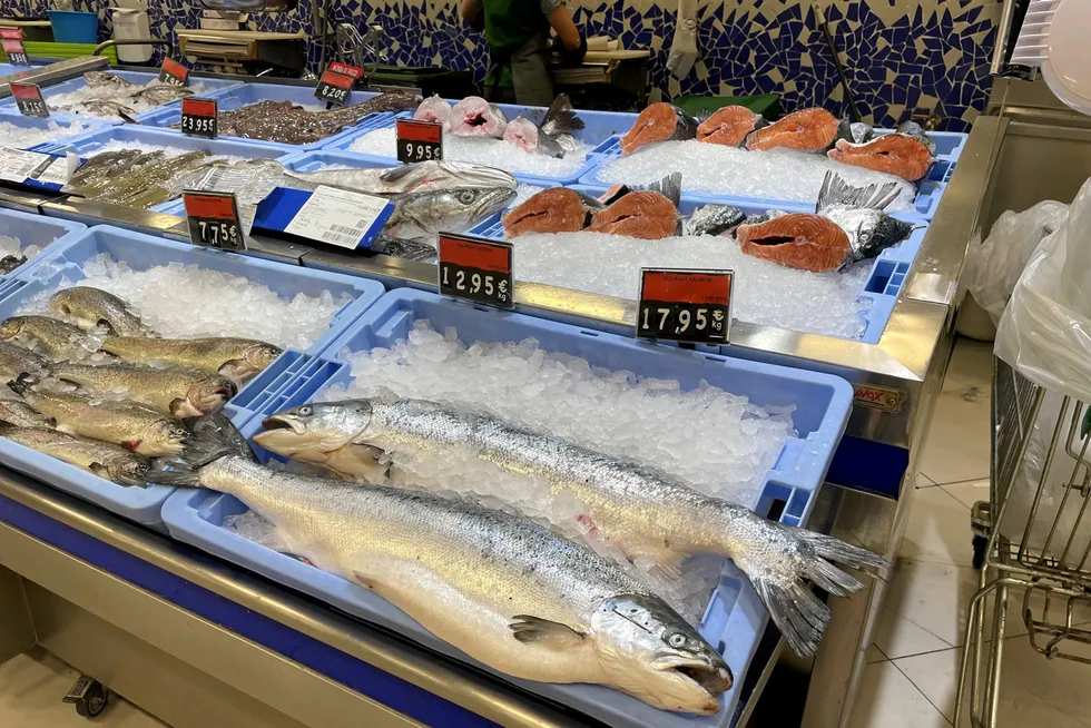 Sales of farmed salmon are experiencing a summer slump that is driving down wholesale prices.