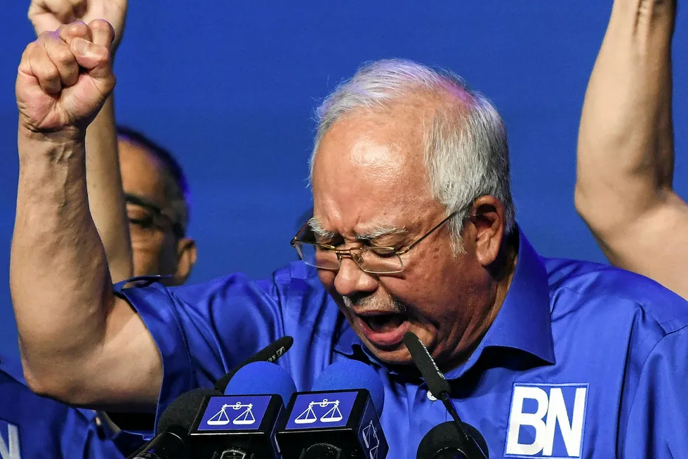 In the mix: Malaysian Prime Minister Najib Razak shouts slogans after launching his coalition’s election manifesto