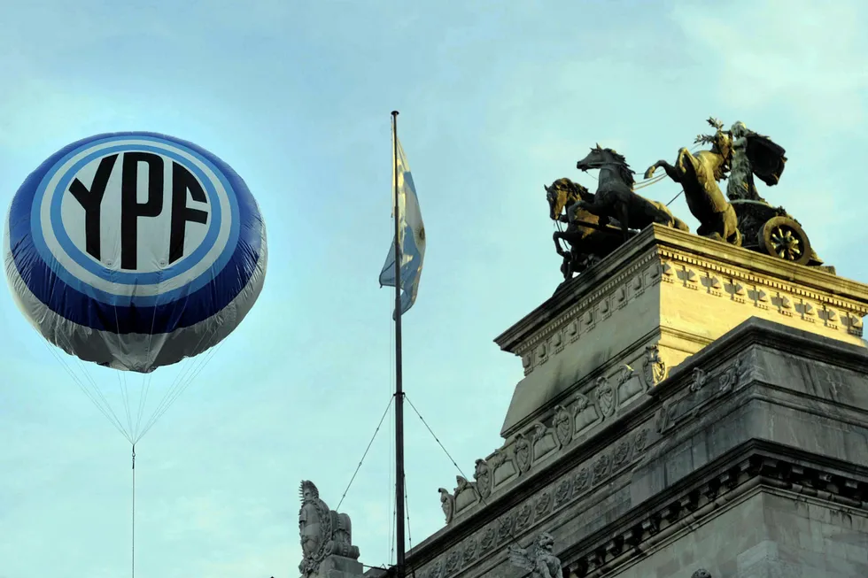On the rise: a balloon with the YPF logo floats in front of Argentina's Congress building in Buenos Aires