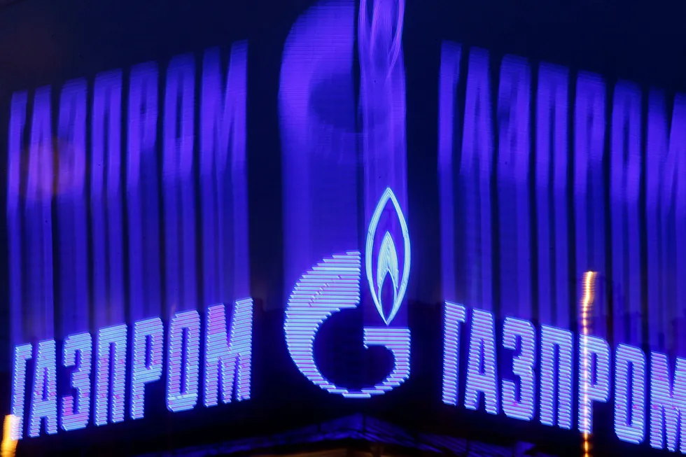 Free fall: Gazprom's logo is seen on an advert installed on the roof of a building in St. Petersburg. The Russian gas giant reported significant declines in international gas sales in the first half of 2020