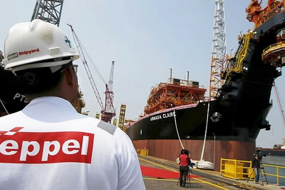 Inching closer: worker at Keppel Shipyard in Singapore