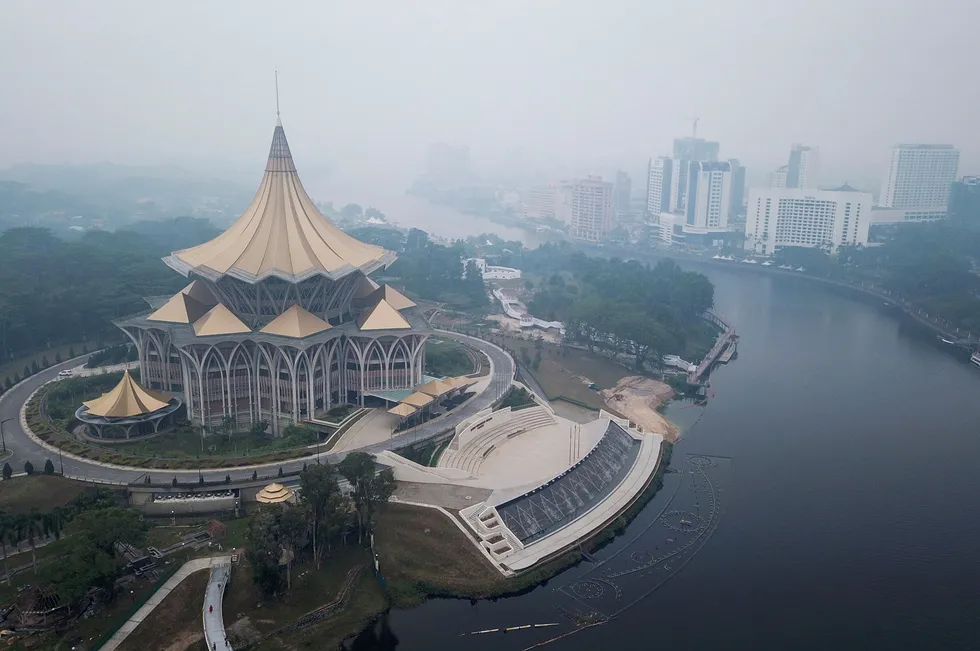 Haze shrouds the ariel view around Sarawak Legislative Assembly building (L) in Kuching, the capital city of Sarawak state, in this September 2019 file photo.