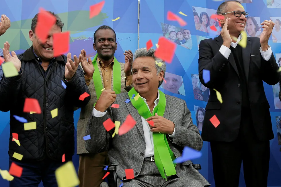 Victor: Ecuador's President Elect Lenin Moreno, centre, celebrates his election triumph