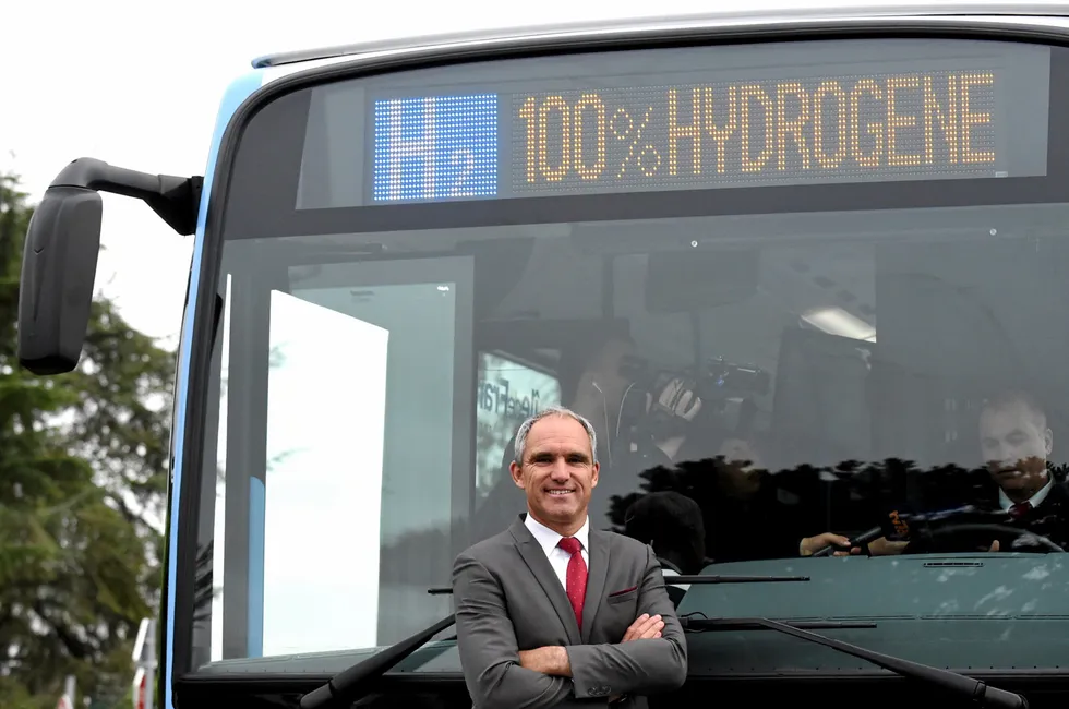 Former Group Savac President Geric Bigot poses in front of the first hydrogen bus in Les Loges-en-Josas, on September 12, 2019 west of Paris.