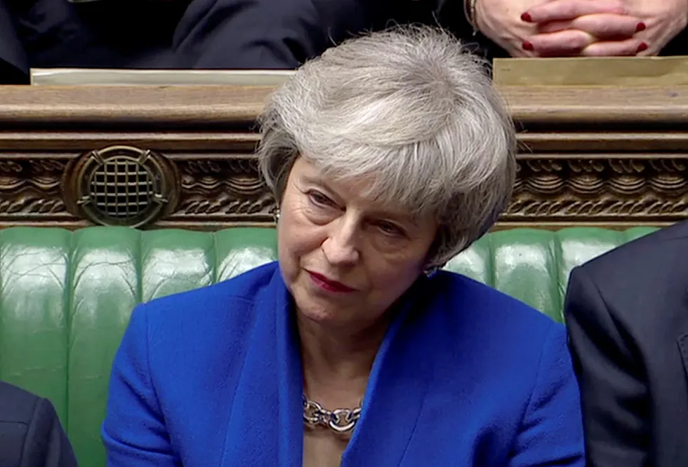 British Prime Minister Theresa May listens as Jeremy Corbyn speaks, after she won a confidence vote, after Parliament rejected her Brexit deal, in London, Britain, January 16, 2019, in this screen grab taken from video. Reuters TV via REUTERS