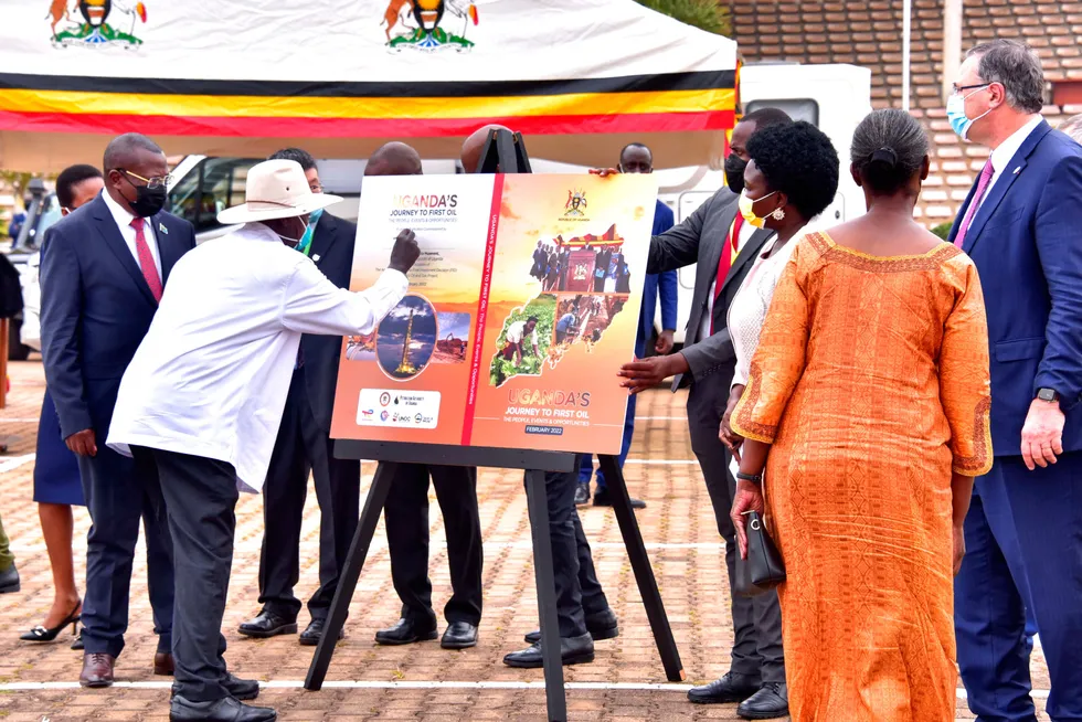 Poster project: Uganda's President Yoweri Museveni signed a poster during a ceremony in Kampala that marked the final investment decision for the Tilenga-Kingfisher-EACOP oil project that will see oil piped from Lake Albert to Tanga on Tanzania's coast