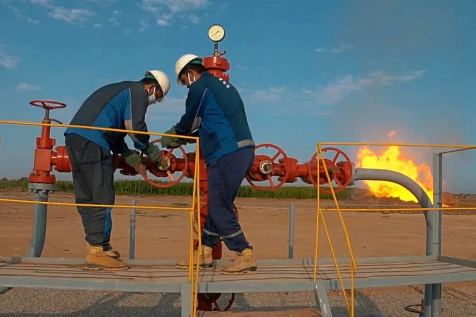 Expansion: workers opening taps to flow test an exploration well on the Ayzavat structure in Uzbekistan, operated by US-based Epsilon Development