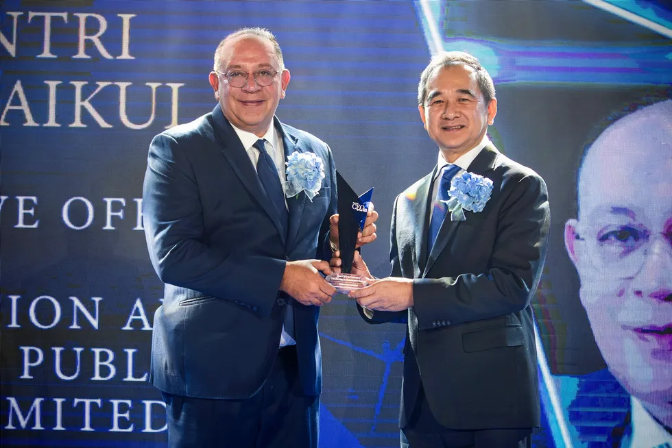 Recognition: PTTEP chief executive Montri Rawanchaikul (left) receives an award from Thailand’s Deputy Finance Minister Krisada Chinavicharana.