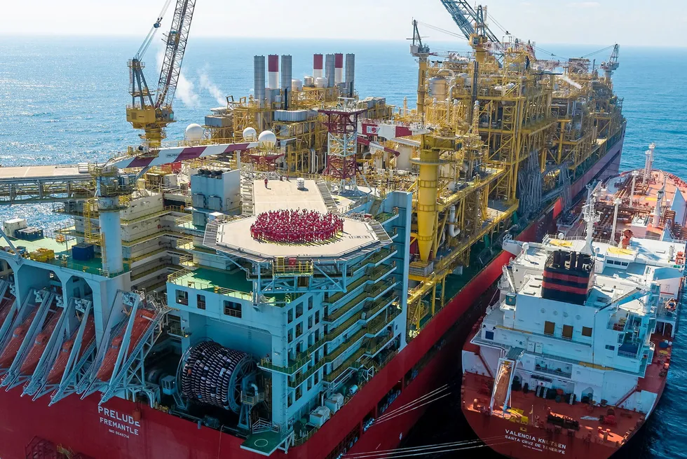 .Workers on Shell's Prelude FLNG with the LNG carrier Valencia Knutsen alongside.