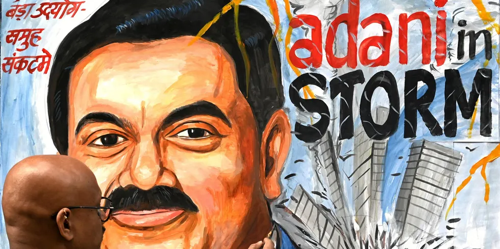 Art school teacher Sagar Kambli paints Indian businessman Gautam Adani highlighting the ongoing crisis of the Adani group.