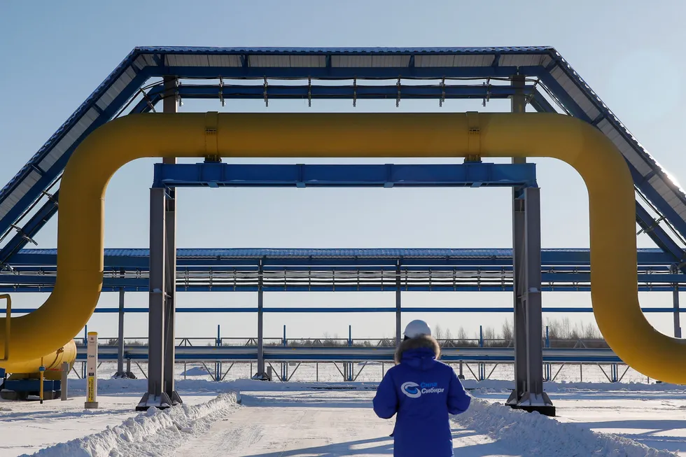 Sudden twist: an employee walks past a part of the Gazprom-operated Sila Sibiri pipeline to China outside the town of Svobodny, in Russia’s far east Amur region