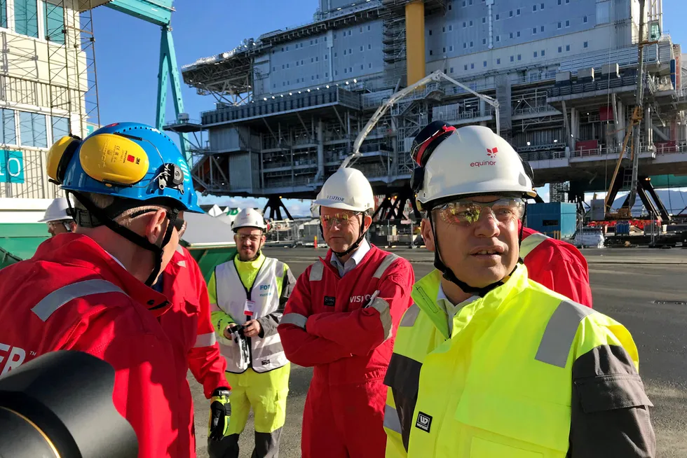 On site: Equinor chief executive Anders Opedal (right) in front of the Johan Sverdrup living quarters platform at Kvaerner’s Stord yard in Norway
