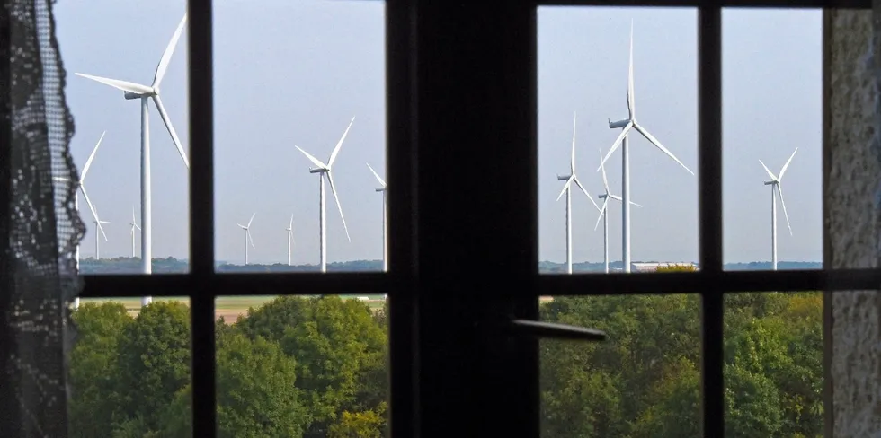 Wind turbines are pictured from a resident's house in Montagne-Fayel, northern France, where an association of residents was protesting against a wind farm project in their immediate living area.