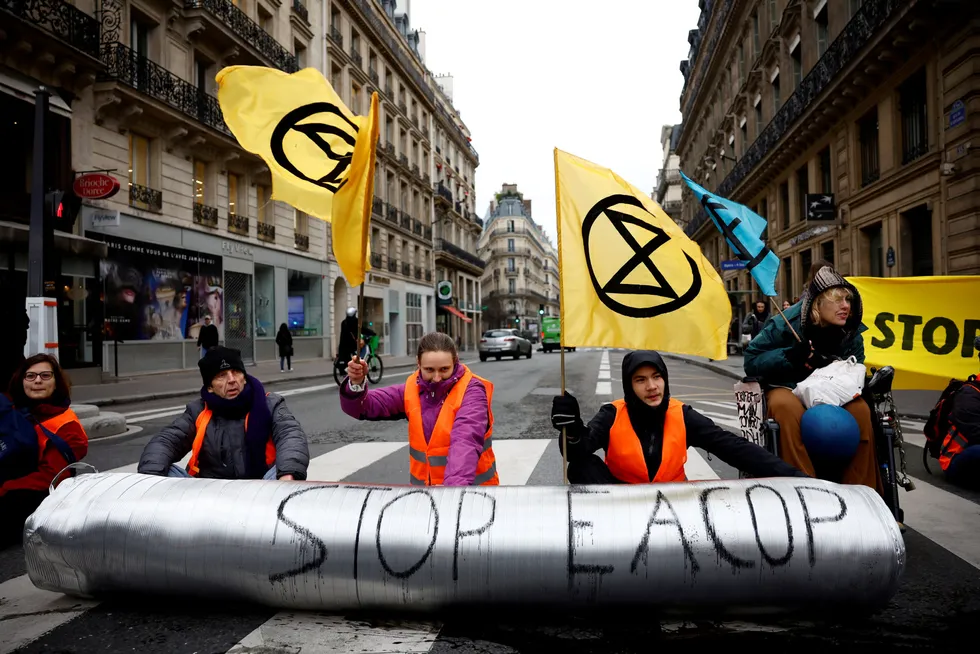 Up in arms: Climate change activists from Extinction Rebellion France block the traffic on a street with a pipeline replica during a protest against TotalEnergies and the EACOP project in East Africa.