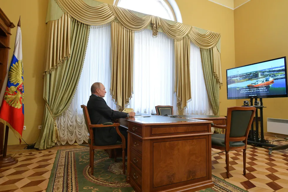 LNG importance: Russian President Vladimir Putin watches a broadcast of a ceremony to load a first carrier at Novatek-led Vysotsk LNG project on the Baltic Sea in 2019.