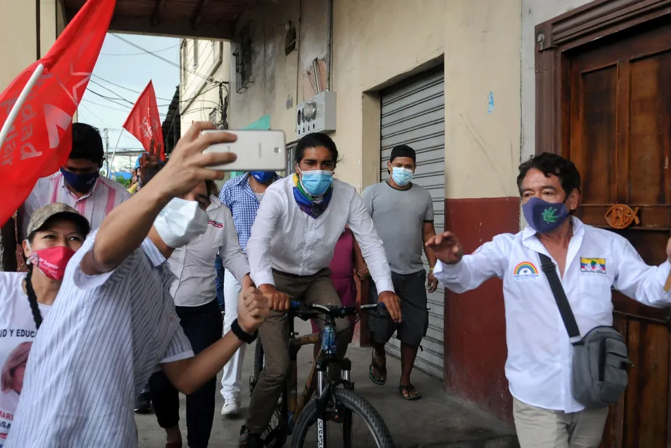 Selfie: Ecuadorean presidential candidate for the Pachakutik indigenous movement Yaku Perez rides his bike during the closing rally of his campaign