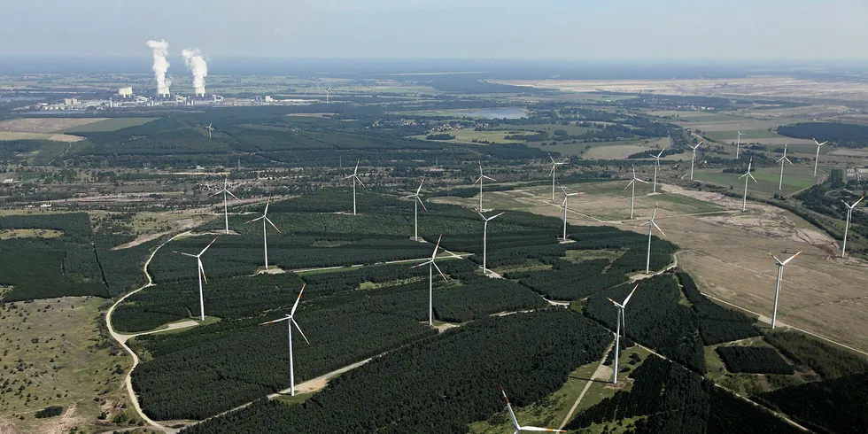 Wind turbines in Germany with cooling towers at coal-fired power plant