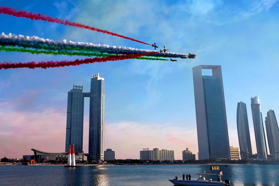 Net Zero: The United Arab Emirates' Al-Fursan (The Knights) National Aerobatic Team performs with smoke with the colours of the UAE flag in the Emirati capital Abu Dhabi