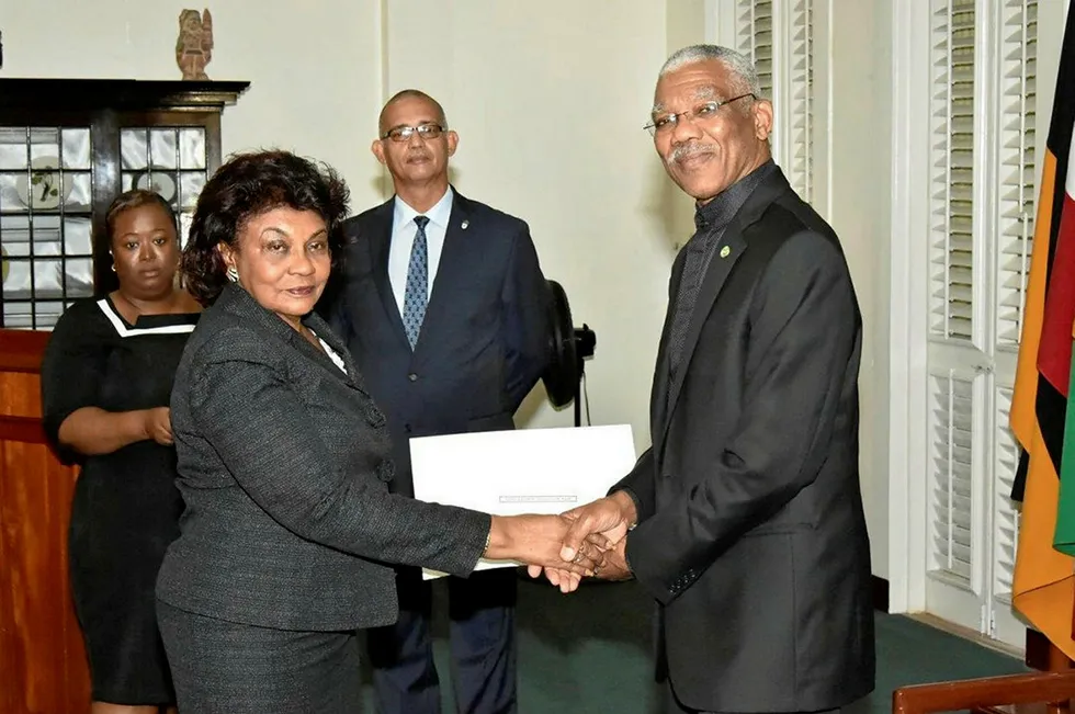 Controversy: Claudette Singh, head of Guyana's electoral commission, taking up her post in the presence of President David Granger