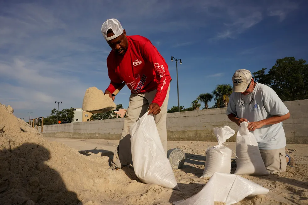 Preparing: US Gulf Coast residents fill sand bags as they prepare for the expected arrival of Hurricane Ida on Sunday