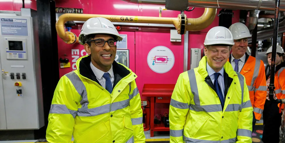 UK Prime Minister Rishi Sunak and Secretary of State for Energy Security and Net Zero, Grant Shapps (C) are given a tour of a combined heat and power plant.