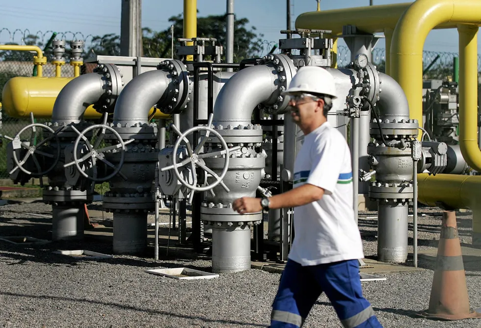 Offer on the pipeline: a Brazilian worker walks past a natural gas regulating station in the Brazilian city of Cubatao, where the majority of the industries depend on natural gas from Bolivia