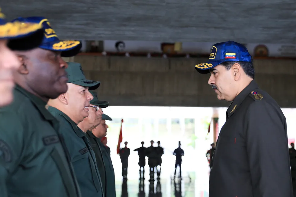 Threatened: Venezuela's President Nicolas Maduro meets military personnel at the Ministry of Defence in Caracas on 28 December 2023.