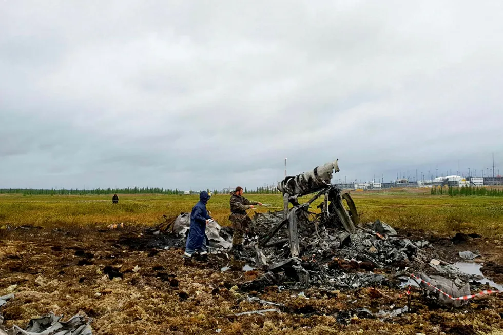 Crash site: investigators at the scene of the downed Mi-8 helicopter in Siberia
