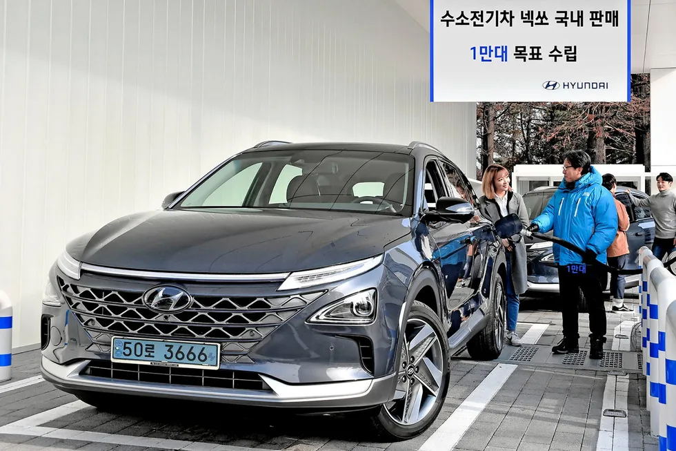 A Hyundai Nexo hydrogen fuel-cell car being refuelled at a South Korean filling station.