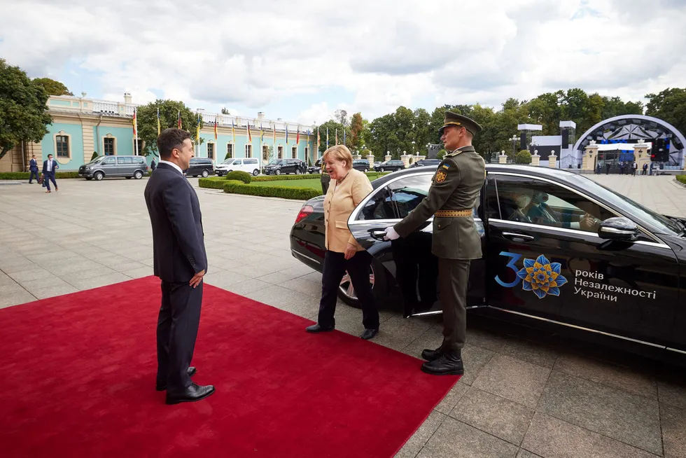 Assurances: Ukrainian President Vladimir Zelensky (left) welcomes German Chancellor Angela Merkel on her arrival for a meeting at the Mariyinsky palace in Kiev