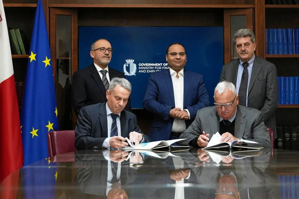 Deal signed: Albion Energy executives sign exploration agreement in Malta, with Ministry of Finance officials in attendance.
