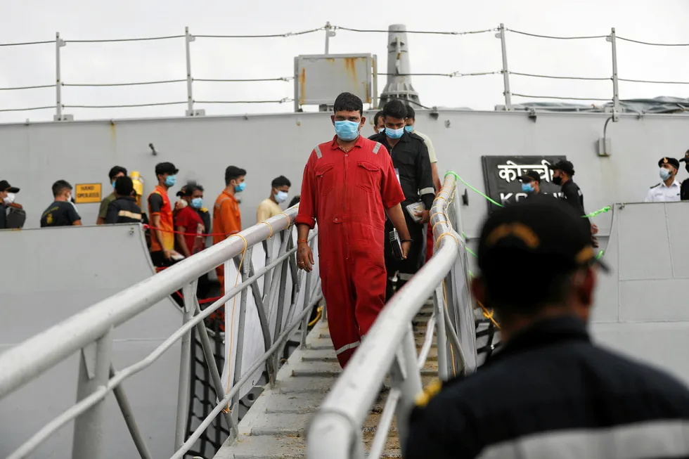 Rescued: people stranded aboard Barge P 305 disembark from the INS Kochi at Mumbai. At least70 lives were lost when Cyclone Tauktae struck the P 305